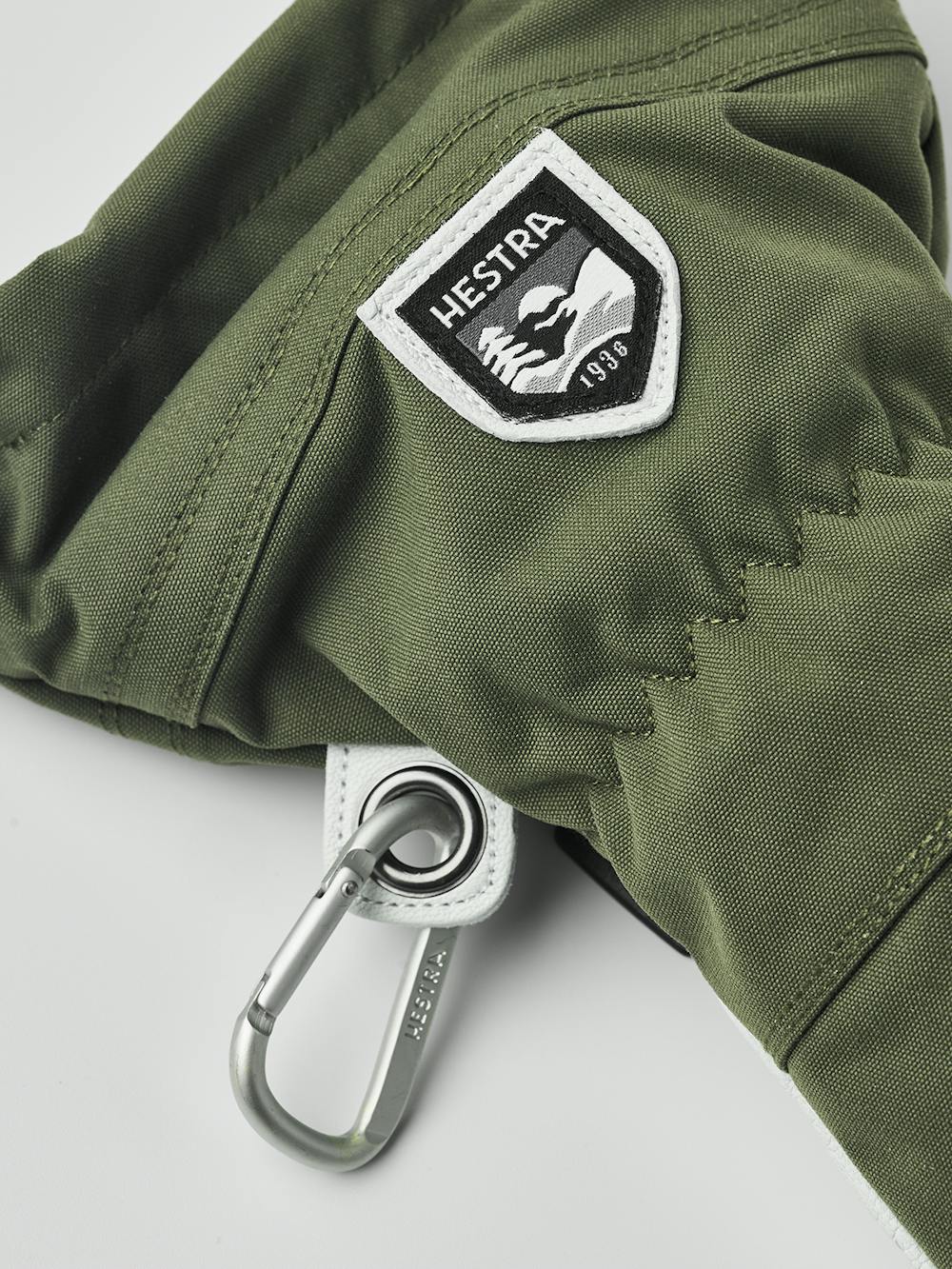 Moosgrüner Skihandschuh mit weißem Ziegenleder an der Innenhand
 (3 oder 11)