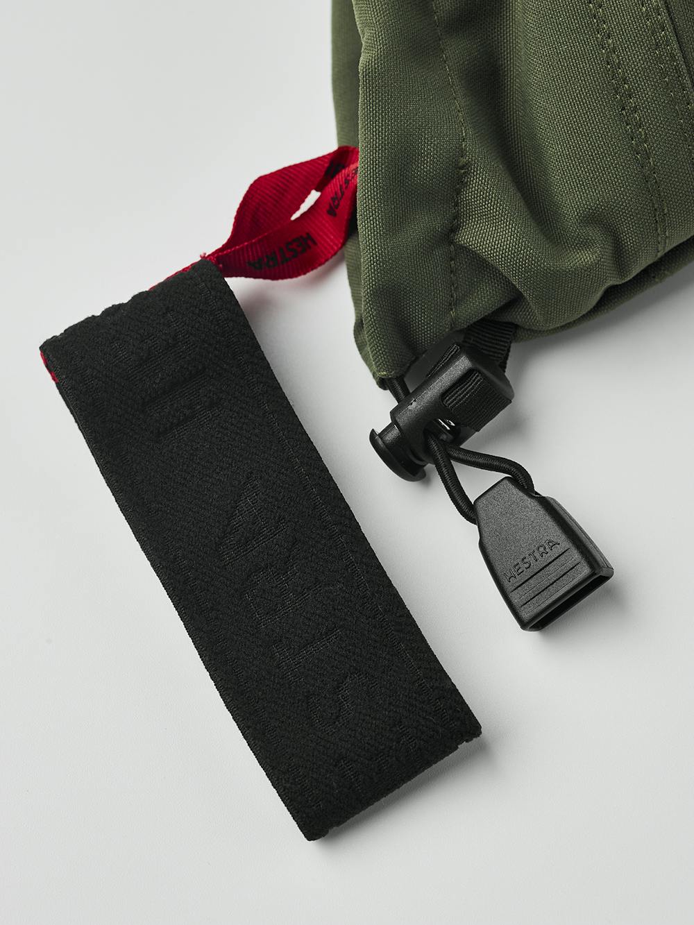 Moosgrüner Skihandschuh mit weißem Ziegenleder an der Innenhand
 (7 oder 11)