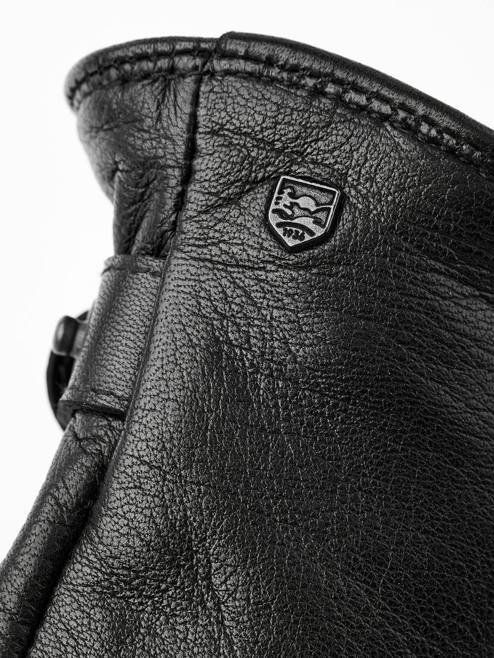 Black machine-sewn hairsheep leather glove with leather strap
(3 of 3)