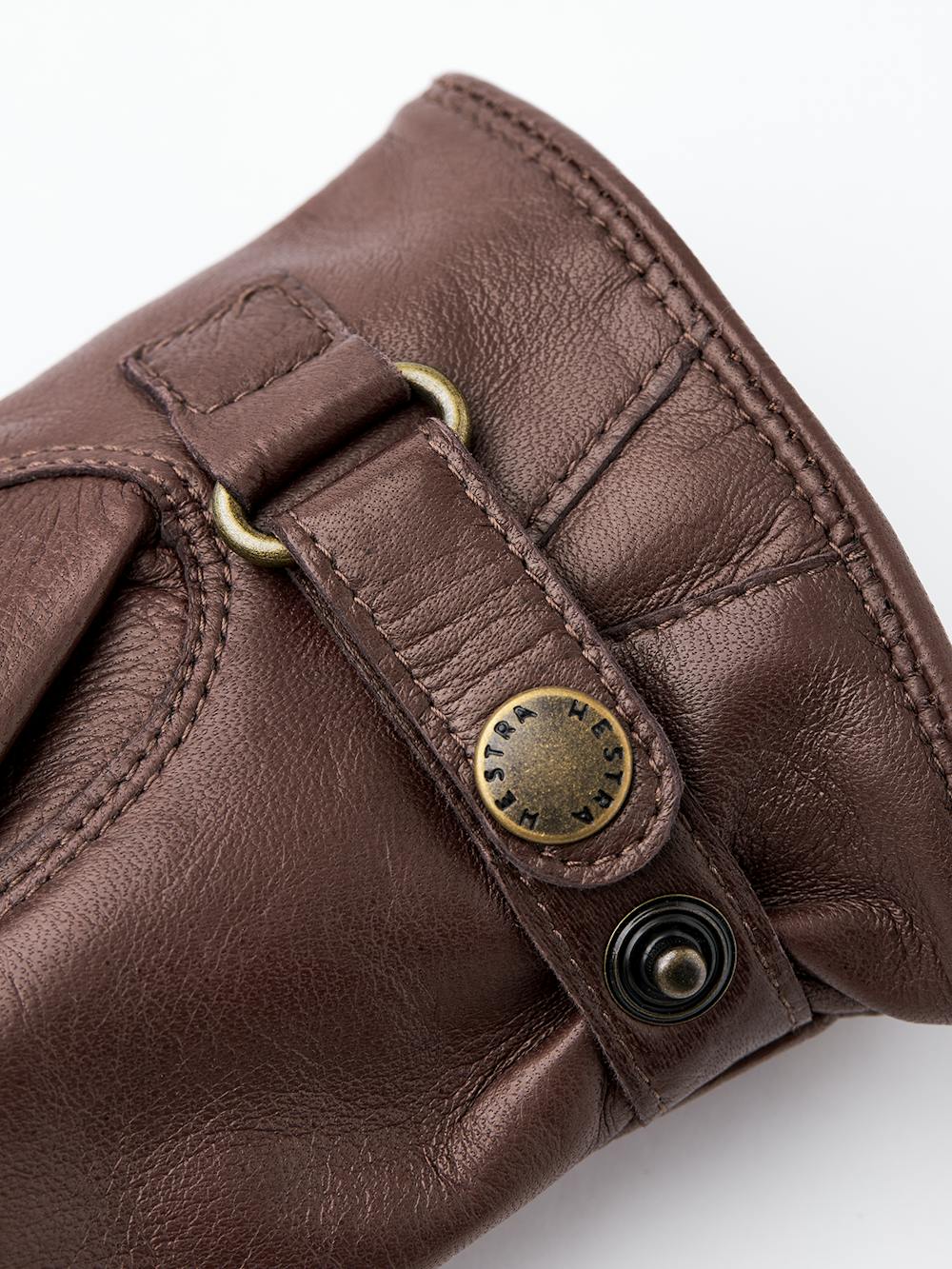 Brown machine-sewn hairsheep leather glove with leather strap
(3 of 3)