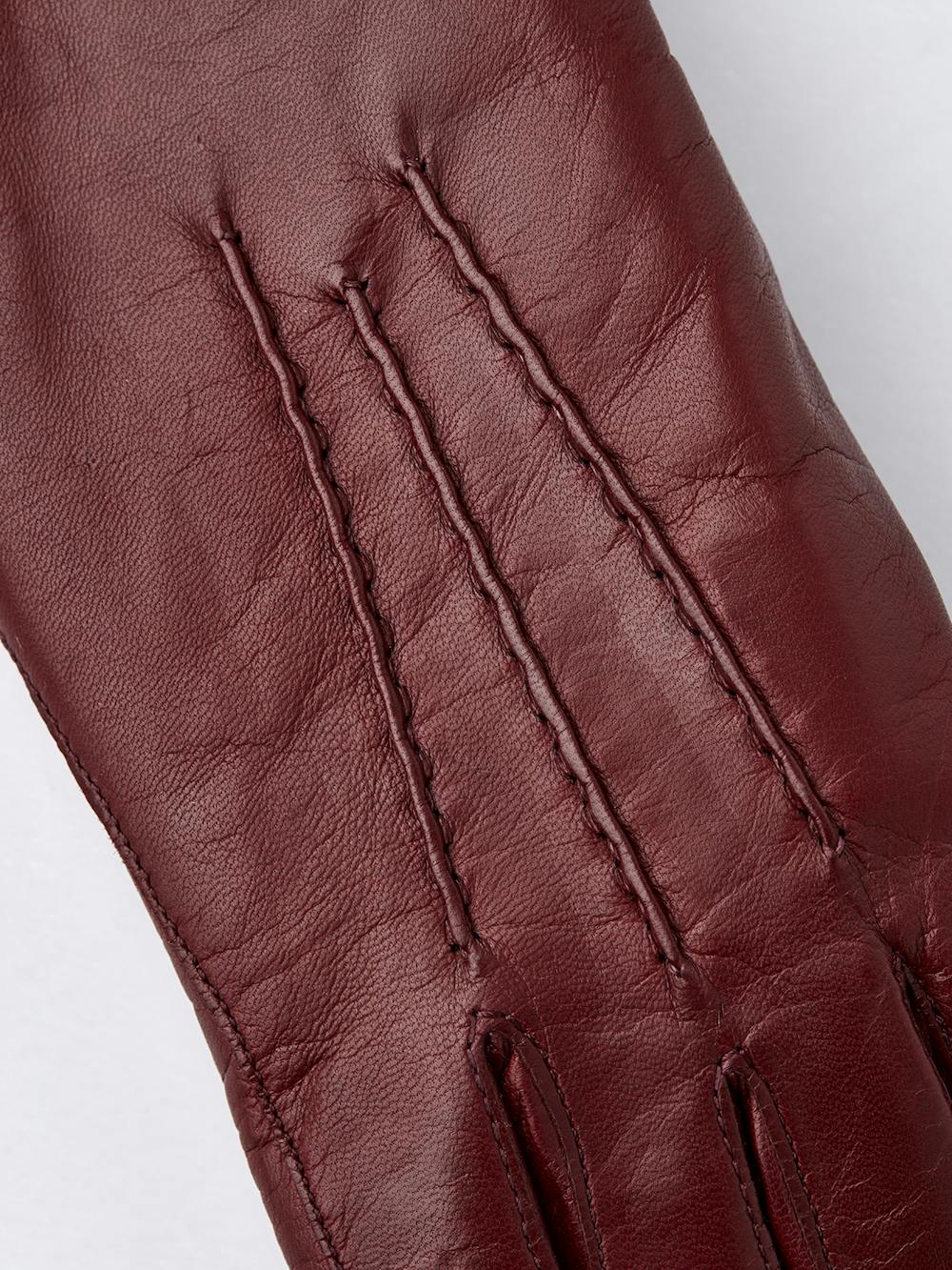 Dark red machine-sewn hairsheep leather glove
(4 of 4)