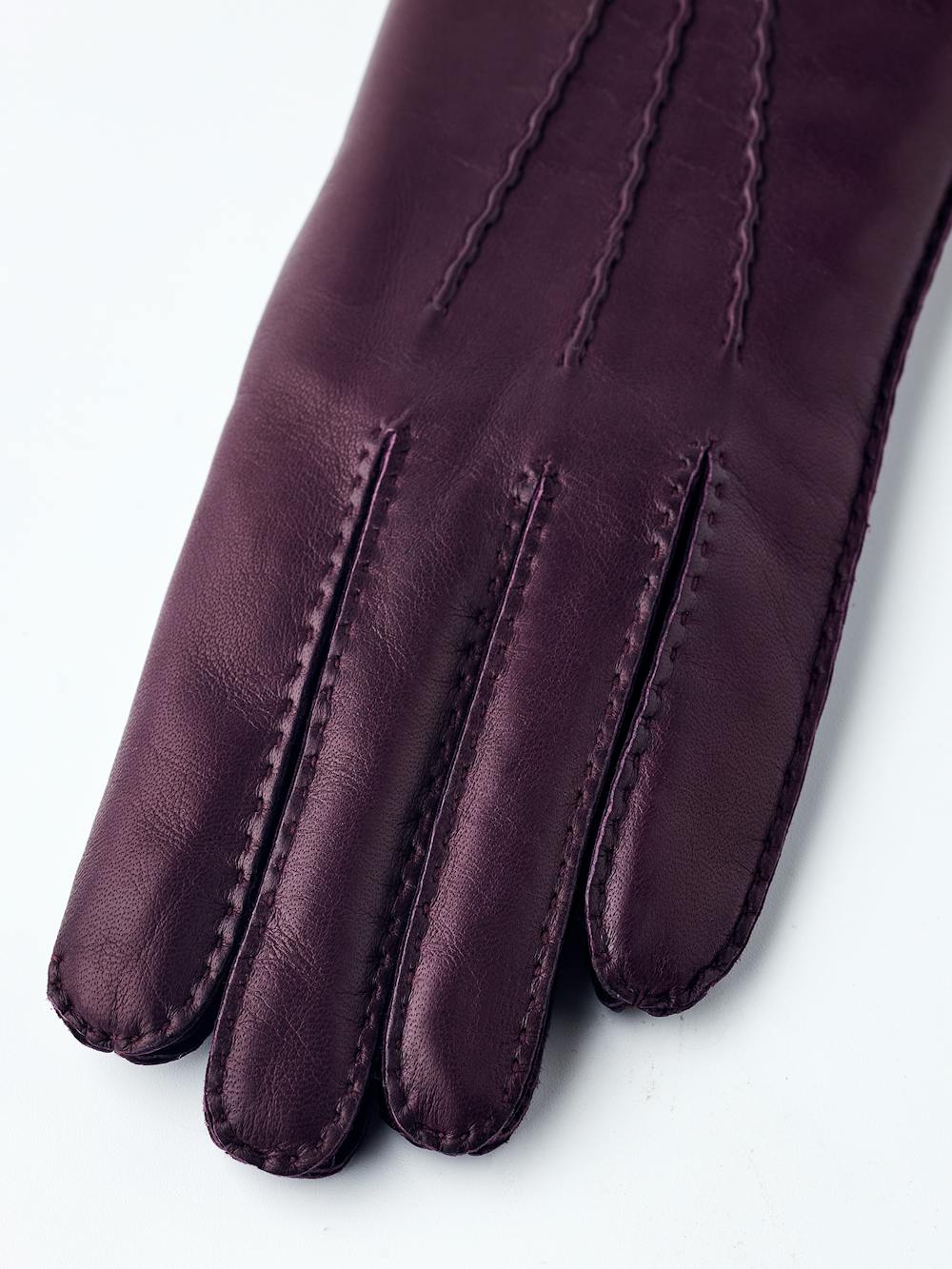 Dunkelvioletter handgenähter Lederhandschuh aus Haarschafleder
(2 oder 6)