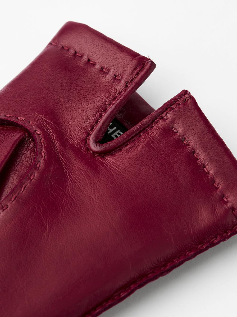 Dark red hand-sewn hairsheep leather glove
(2 of 5)