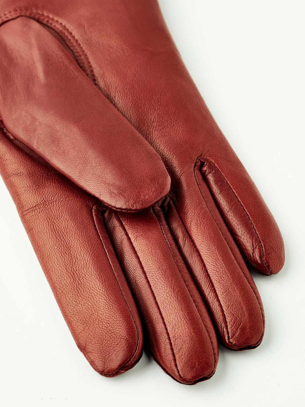 Brown-red machine-sewn hairsheep leather glove with knitted cuff
 (3 of 4)