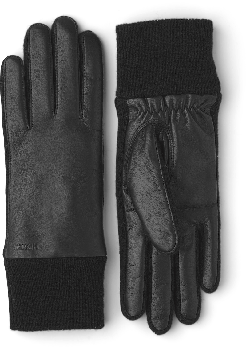 Schwarzer maschinengenähter Lederhandschuh aus Haarschafleder mit Bündchen und seitlichen Einsätzen aus Strick
(1 oder 4)