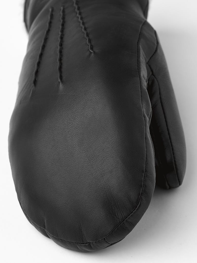 Black machine-sewn hairsheep leather mitten with white fur trim
 (4 of 5)