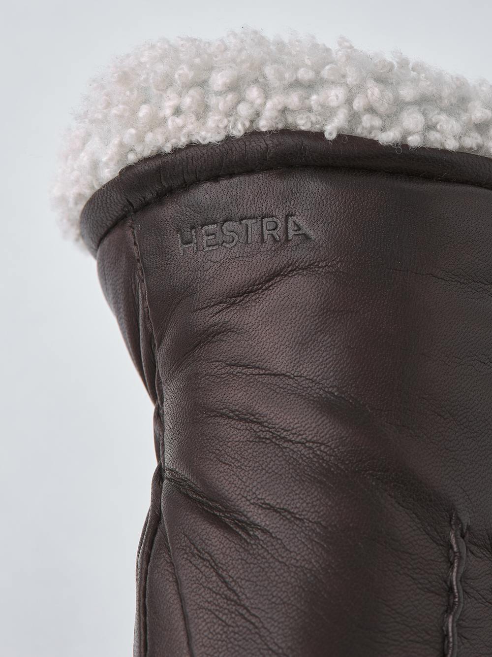 Dark brown machine-sewn hairsheep leather mitten with white fur trim
 (2 of 5)