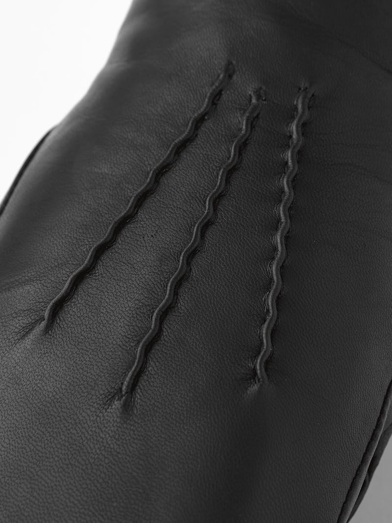 Black machine-sewn hairsheep leather mitten with white fur trim
 (3 of 5)