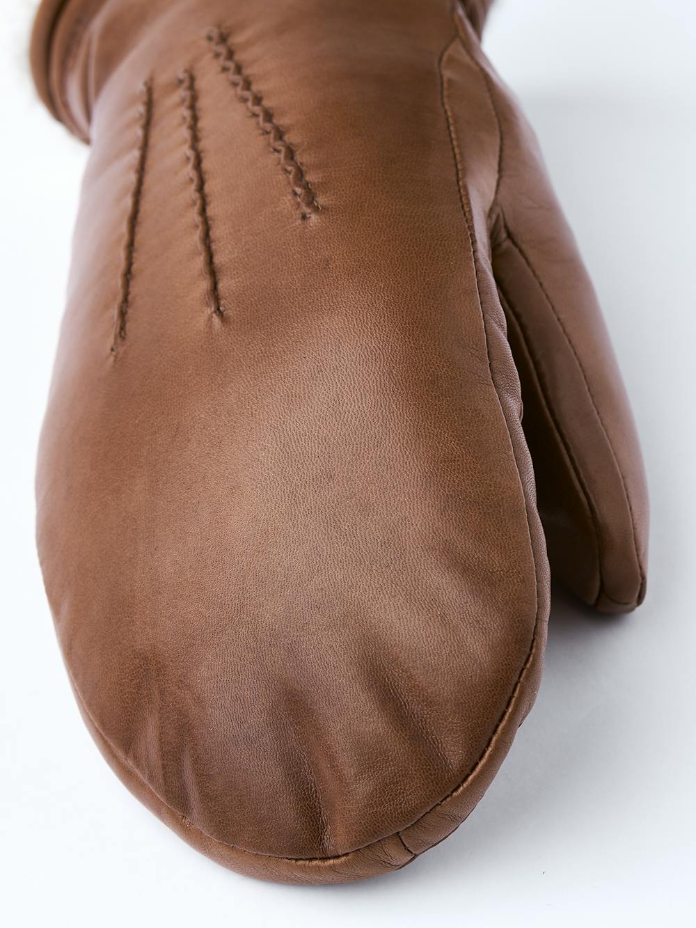 Medium brown machine-sewn hairsheep leather mitten with white fur trim
 (4 of 5)