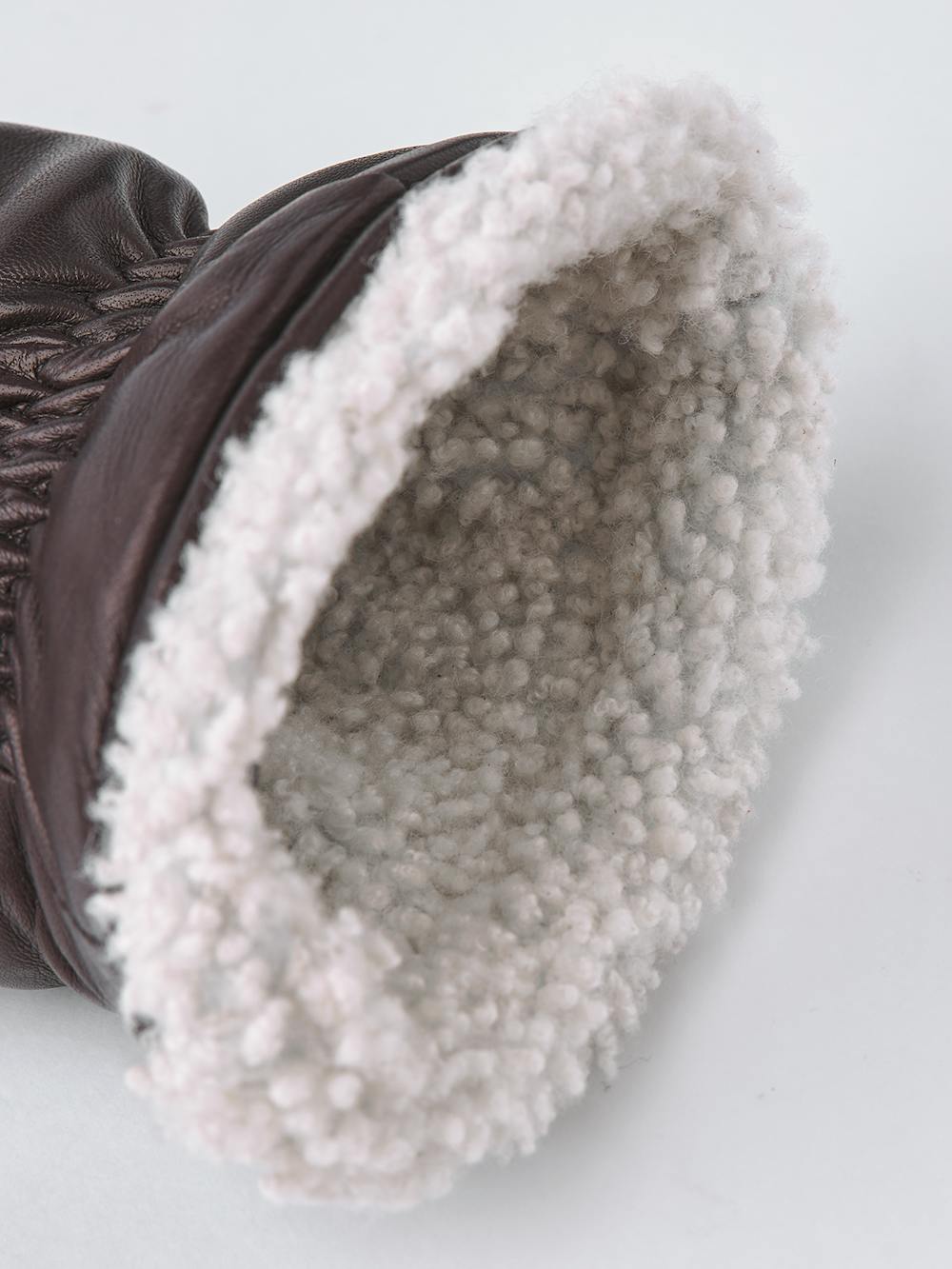 Dark brown machine-sewn hairsheep leather mitten with white fur trim
 (5 of 5)