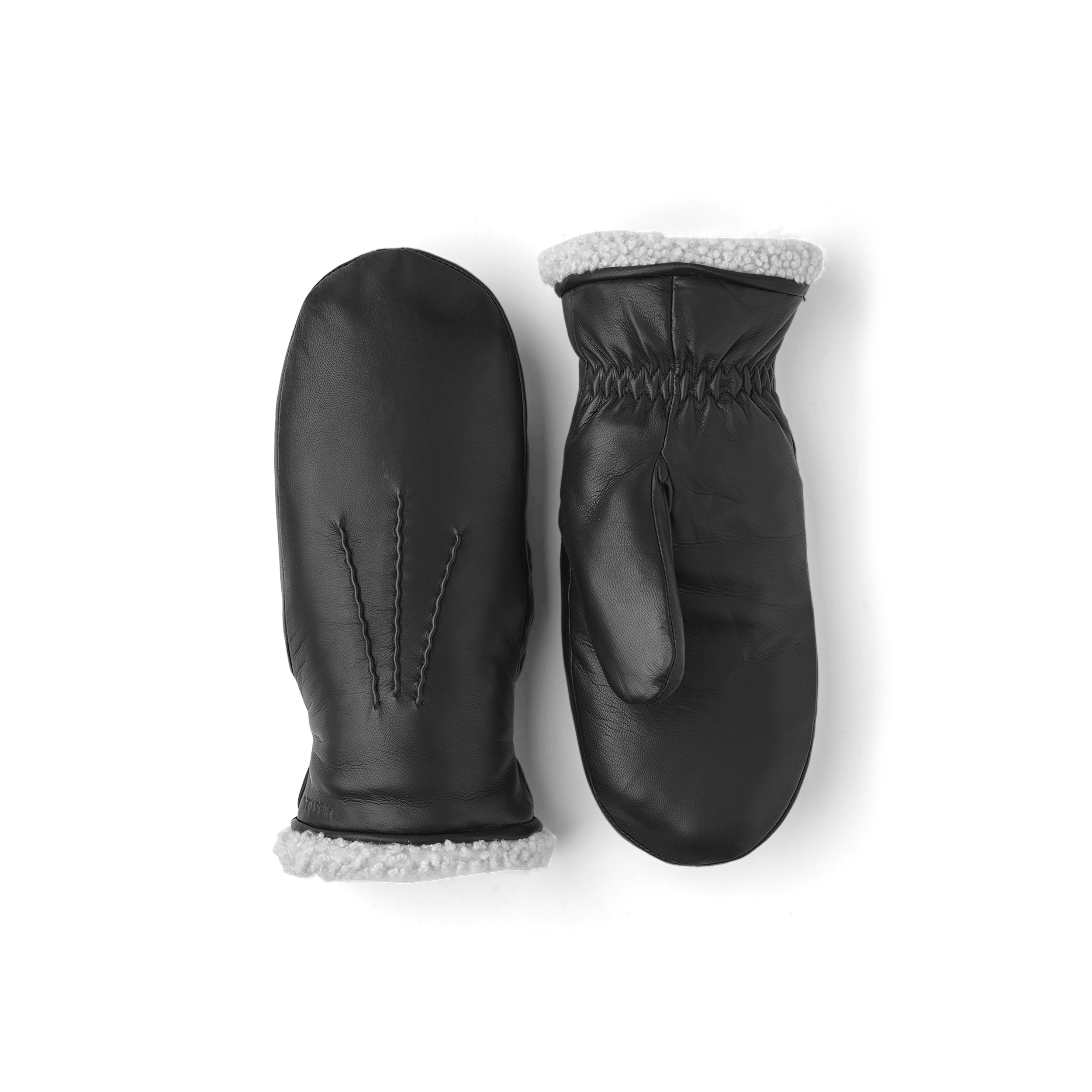 Svart maskinsydd tumhandske i lammnappa med vit pälskrage
 (1 av 5)