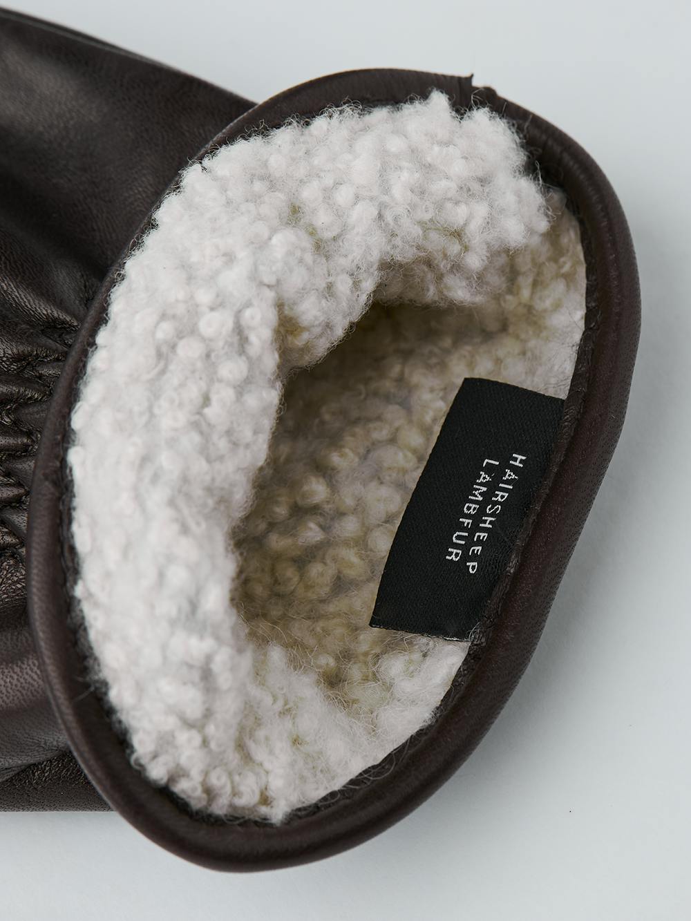 Dunkelbrauner maschinengenähter Fausthandschuh aus Haarschafleder
(4 oder 4)