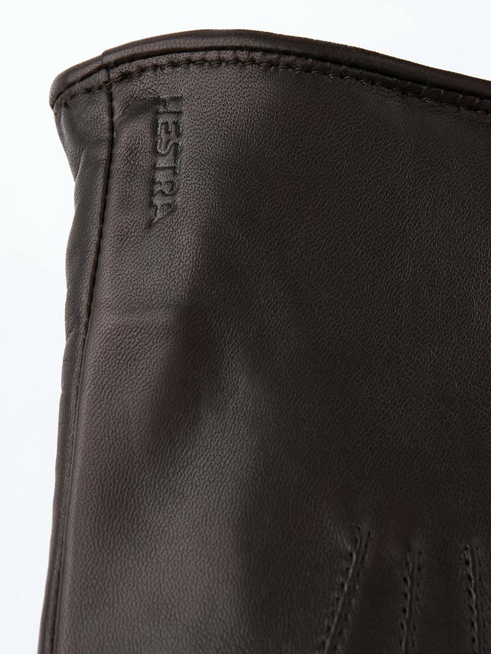 Dunkelbrauner maschinengenähter Fausthandschuh aus Haarschafleder
(3 oder 4)