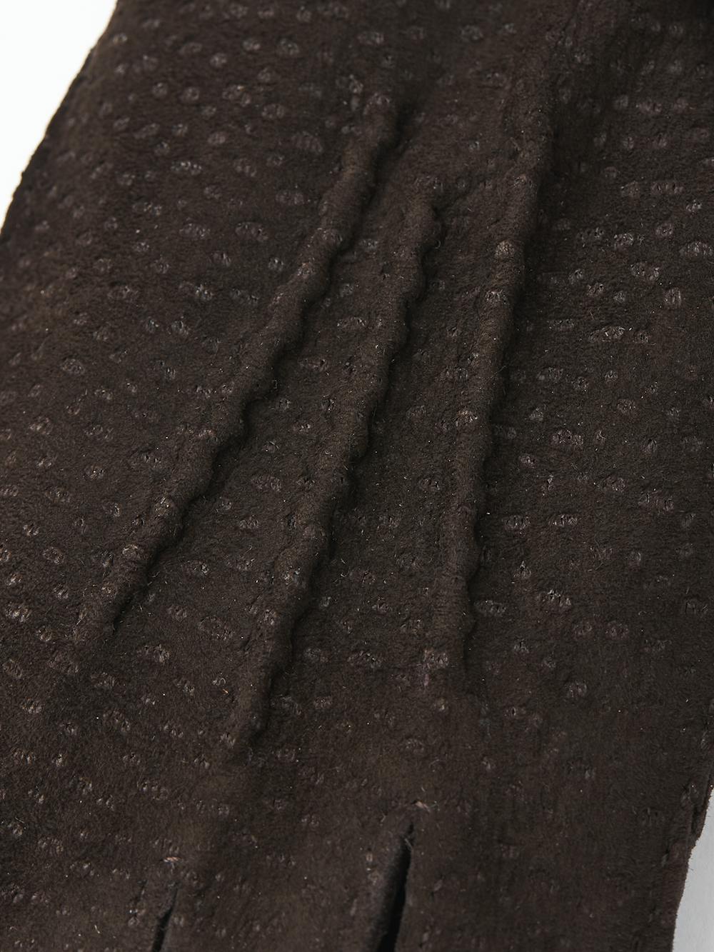 Dark brown hand-sewn glove in carpincho nubuck with leather strap and button
(2 of 4)