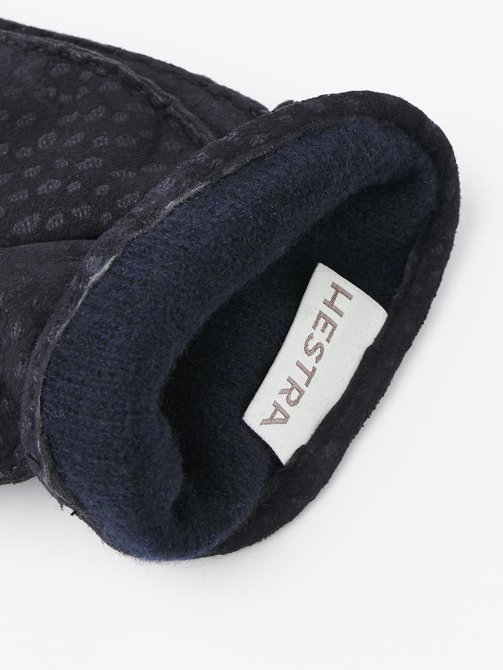 Dark blue hand-sewn glove in carpincho nubuck with leather strap and button
 (4 of 4)