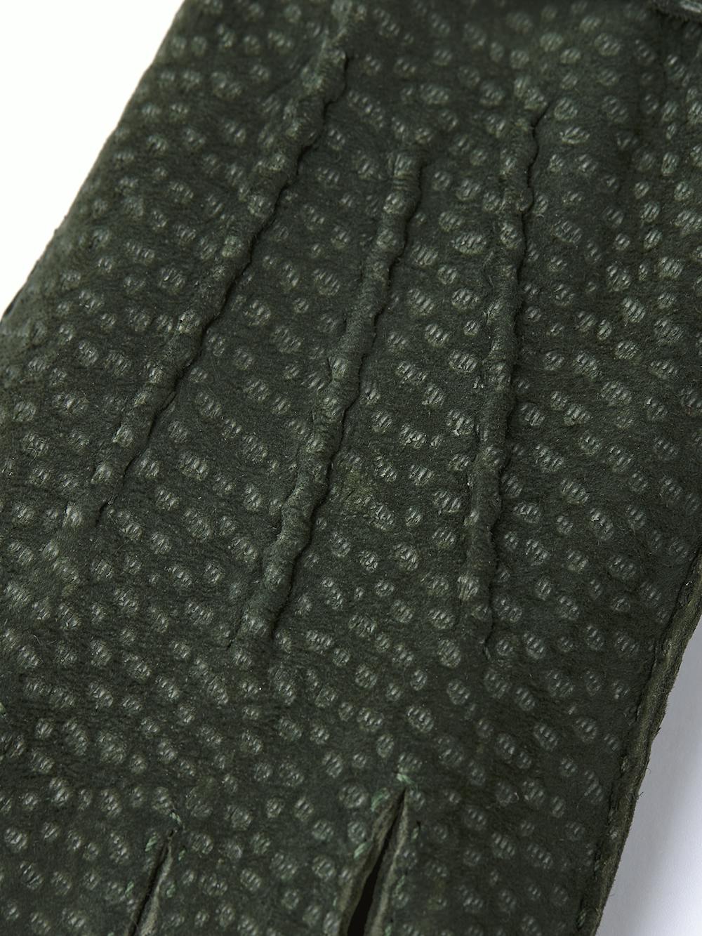 Dark green hand-sewn glove in carpincho nubuck with leather strap and button
 (2 of 4)