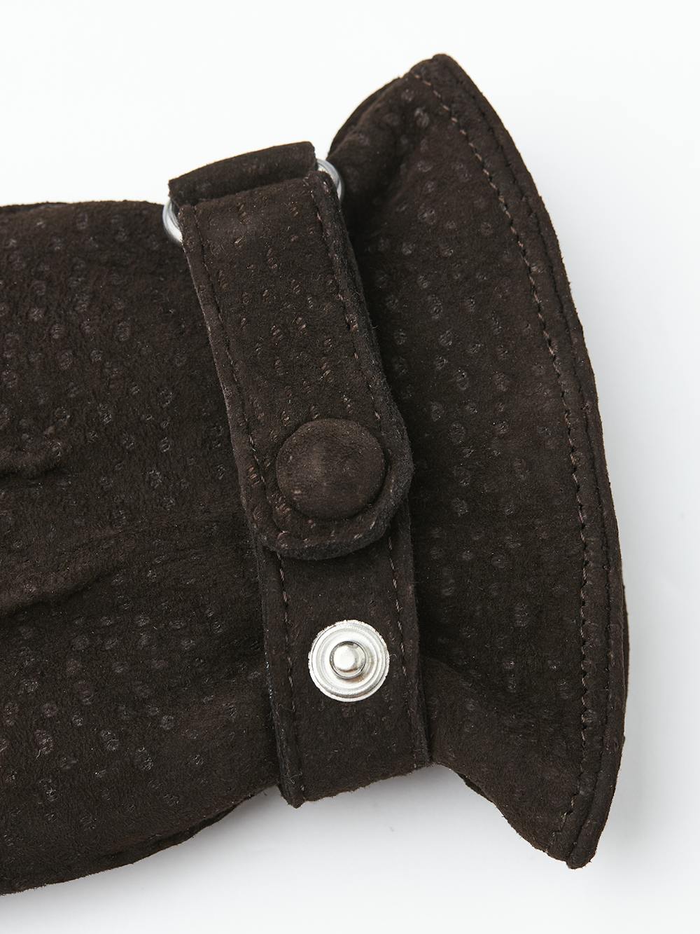 Dark brown hand-sewn glove in carpincho nubuck with leather strap and button
 (3 of 4)