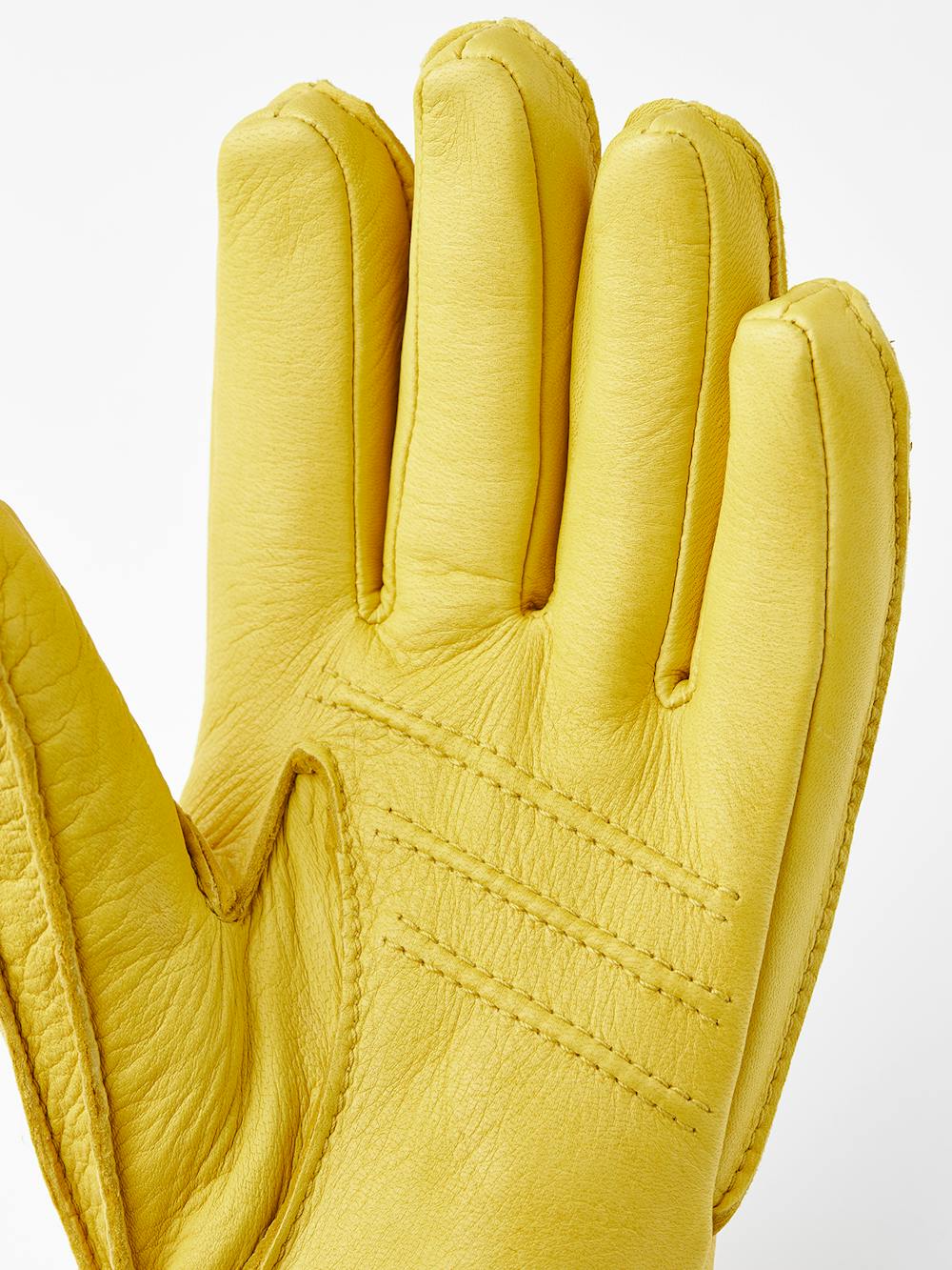 Yellow machine-sewn deerskin glove with knitted cuff
(3 of 3)