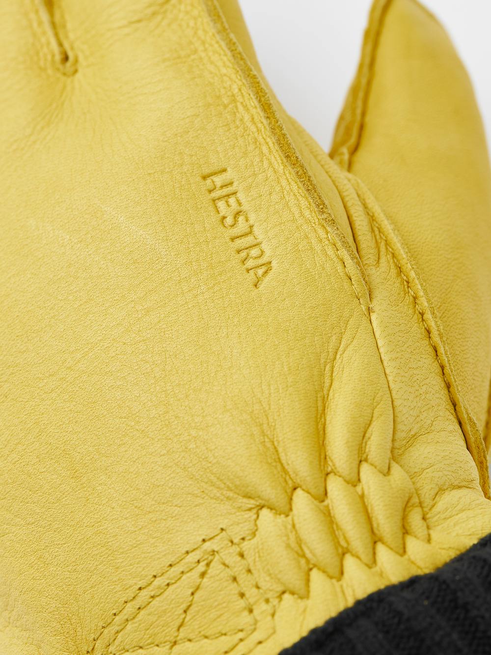 Yellow machine-sewn deerskin glove with knitted cuff
(2 of 3)