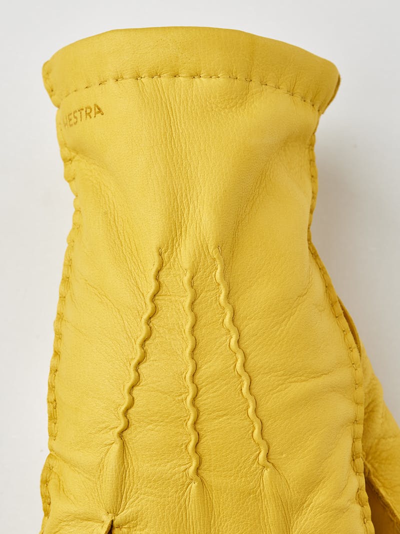 Yellow hand-sewn deerskin glove
 (2 of 4)