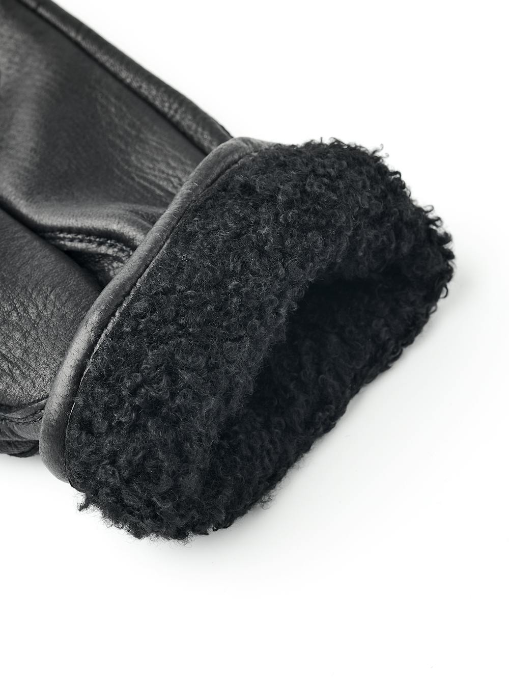 Black machine-sewn deerskin glove with leather strap and button
 (2 of 5)