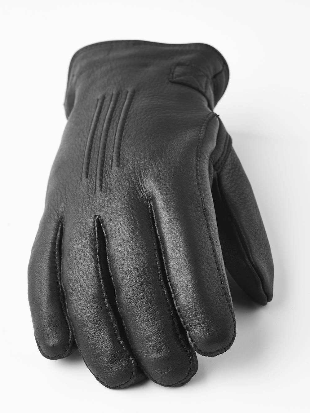 Black machine-sewn deerskin glove with leather strap and button
 (5 of 5)