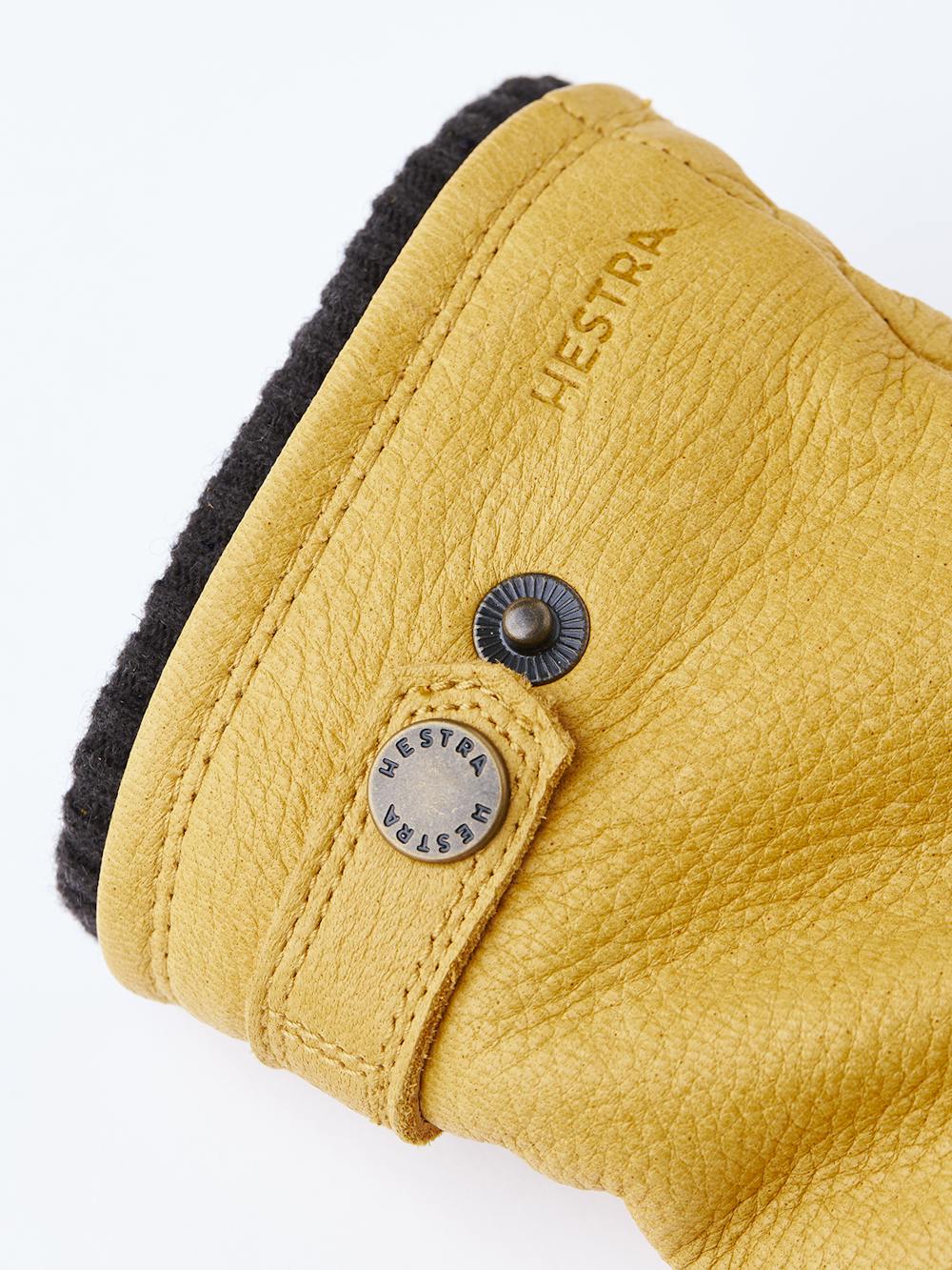 Yellow machine-sewn elk leather glove with leather strap and button
 (2 of 3)