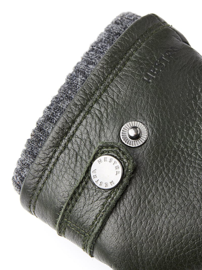 Dark green machine-sewn elk leather glove with leather strap and button
 (2 of 3)