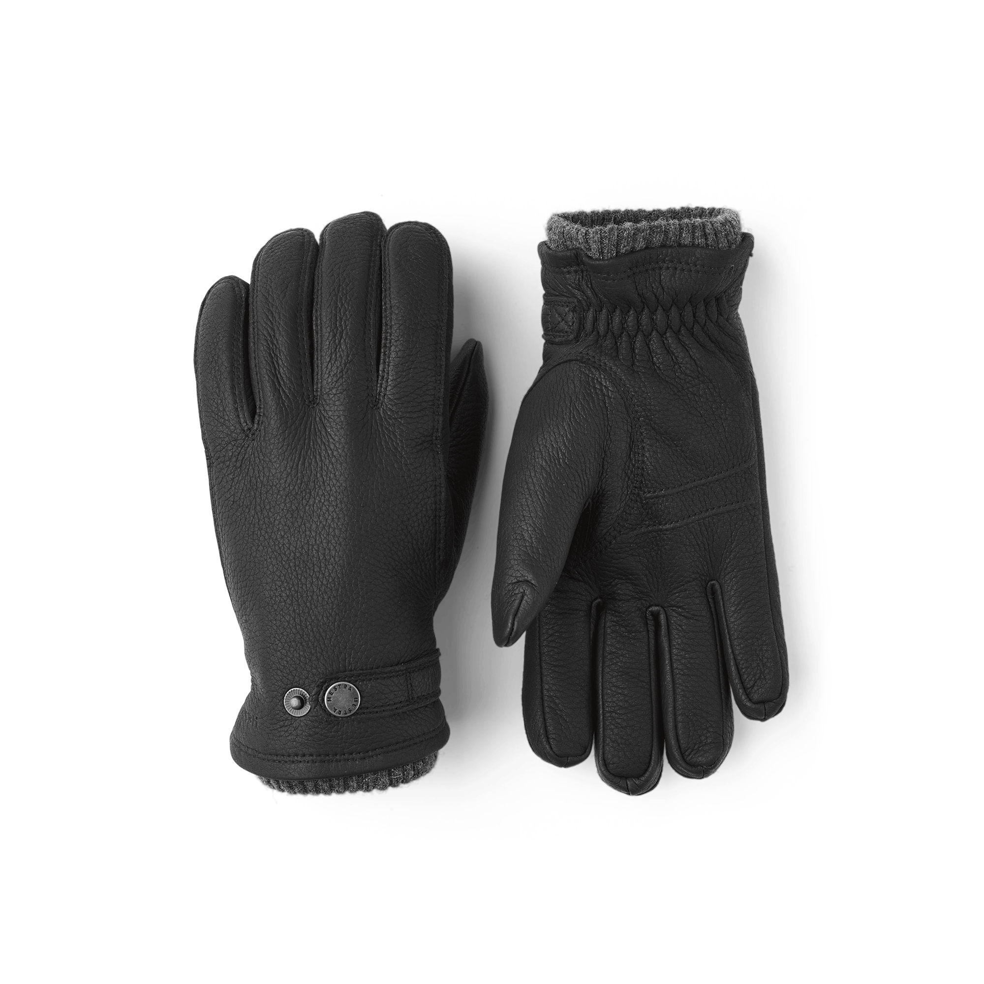 Black machine-sewn elk leather glove with leather strap and button
(1 of 3)