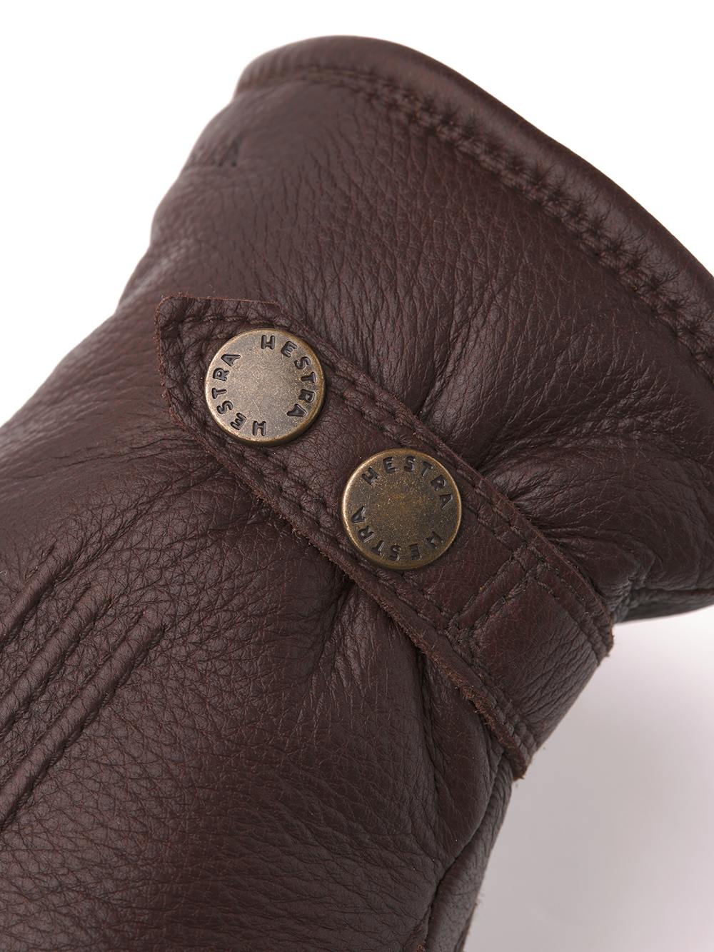 Dark brown machine-sewn elk leather glove with leather strap and button
(3 of 5)