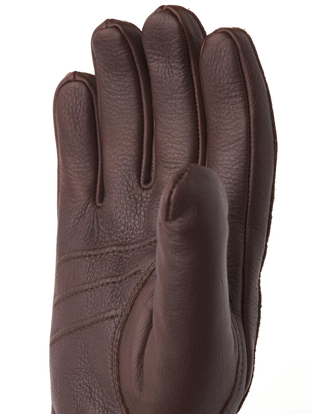 Dark brown machine-sewn elk leather glove with leather strap and button
 (4 of 5)