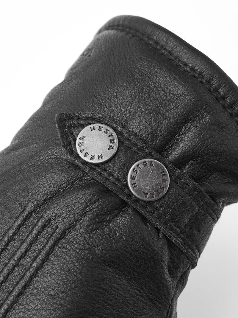 Black machine-sewn elk leather glove with leather strap and button
 (4 of 5)
