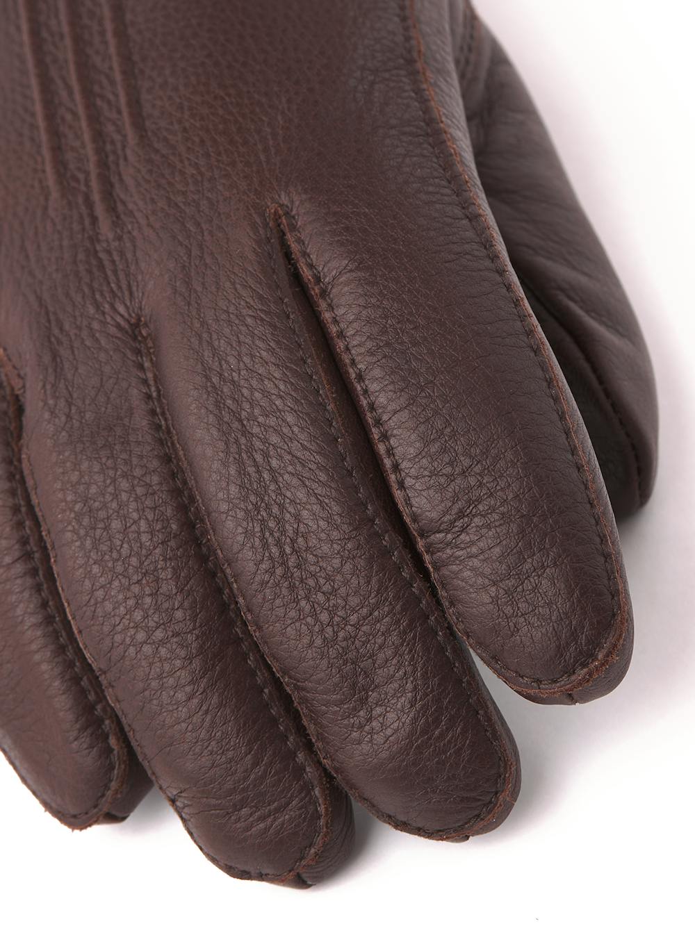 Dark brown machine-sewn elk leather glove with leather strap and button
 (5 of 5)