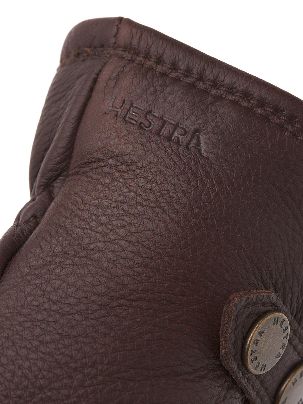 Dark brown machine-sewn elk leather glove with leather strap and button
(2 of 5)