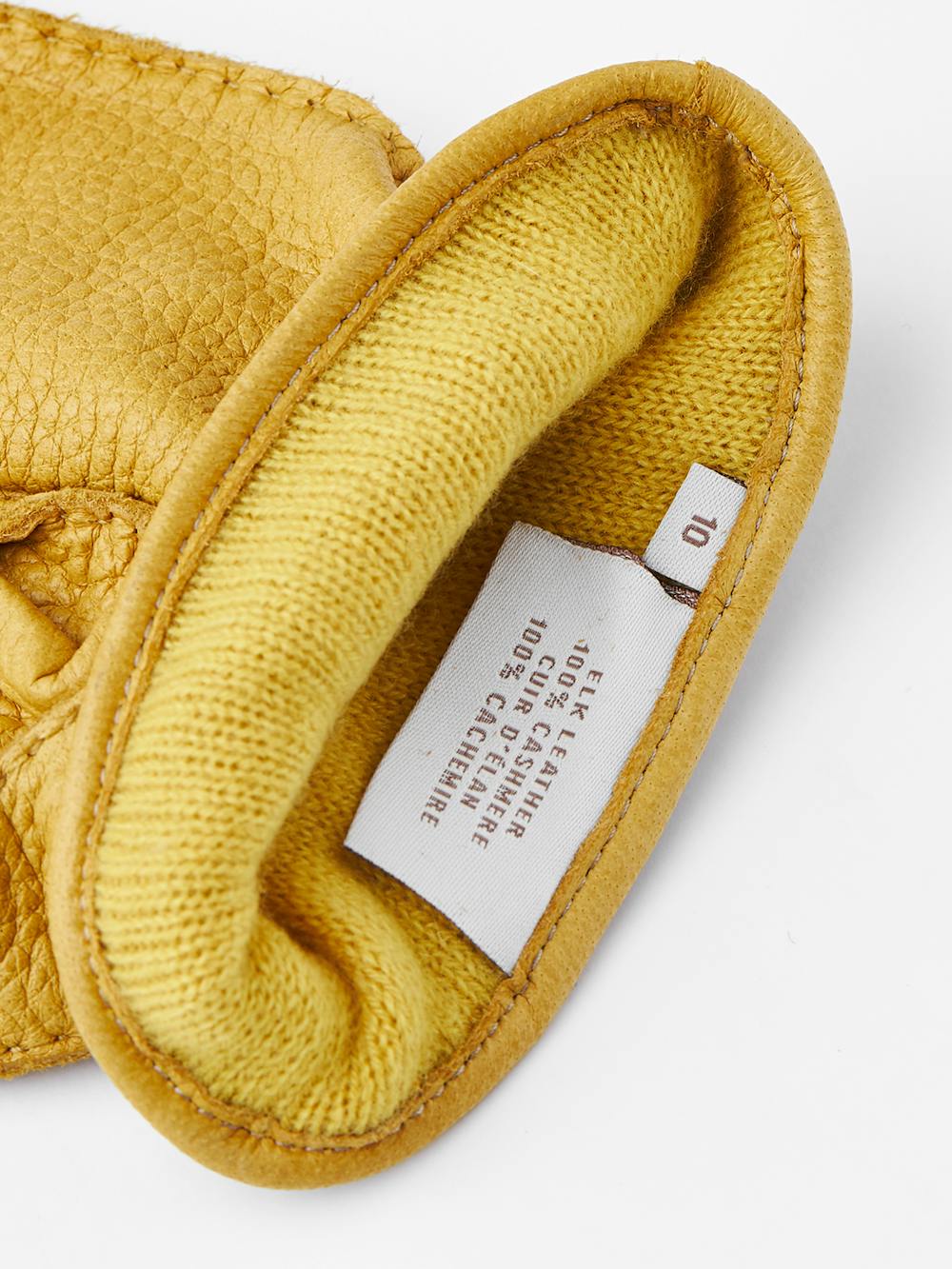 Yellow hand-sewn elk leather glove with leather strap and button
(5 of 5)