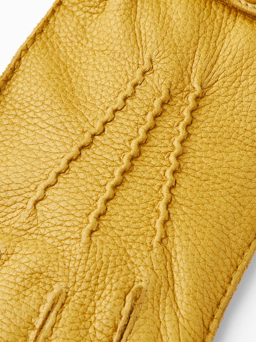 Yellow hand-sewn elk leather glove with leather strap and button
(2 of 5)