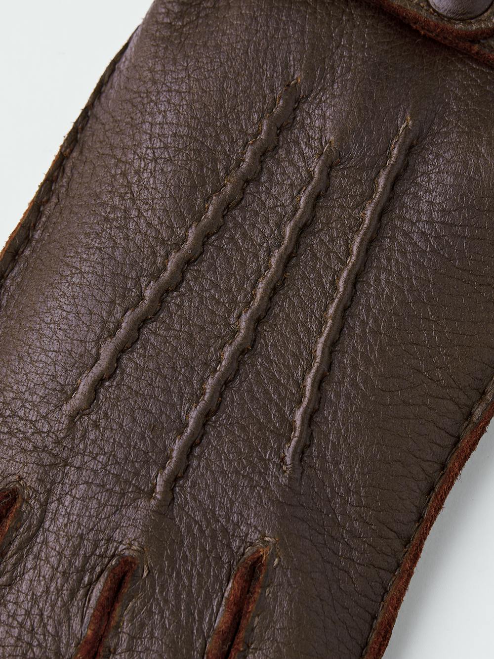 Brown hand-sewn elk leather glove with leather strap and button
 (2 of 5)