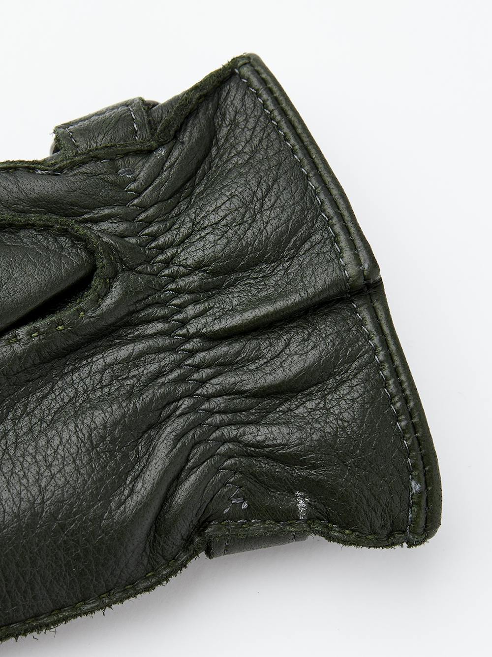 Dark green hand-sewn elk leather glove with leather strap and button
 (4 of 5)