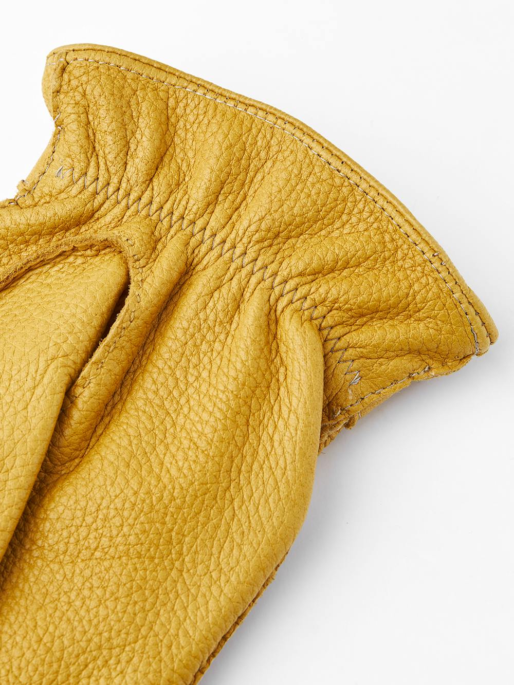 Yellow hand-sewn elk leather glove with leather strap and button
(4 of 5)