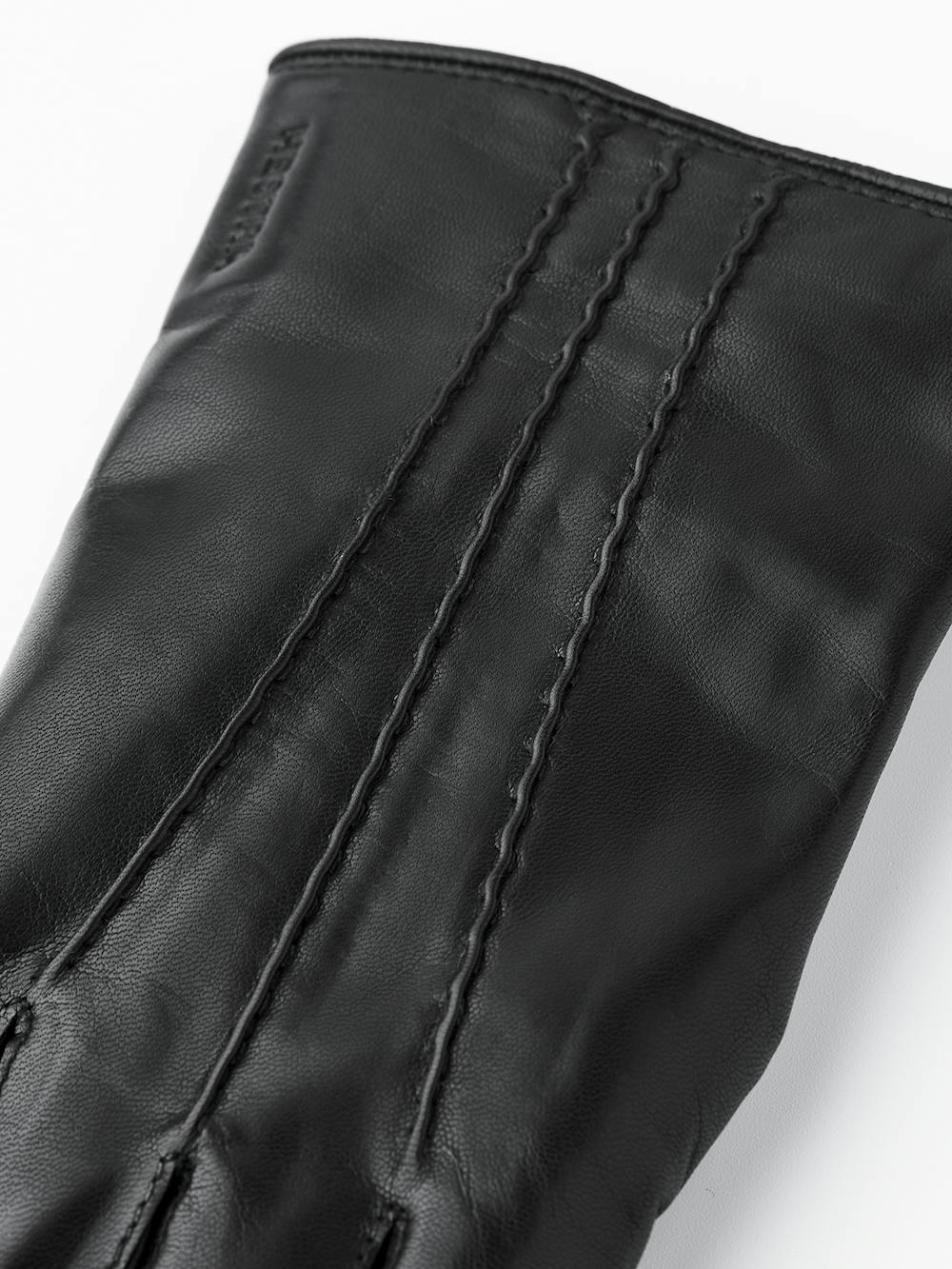 Schwarzer maschinengenähter Lederhandschuh aus Haarschafleder
(5 oder 6)