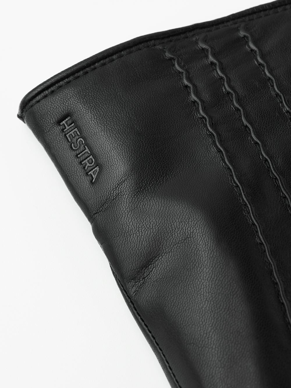 Schwarzer maschinengenähter Lederhandschuh aus Haarschafleder
 (4 oder 6)