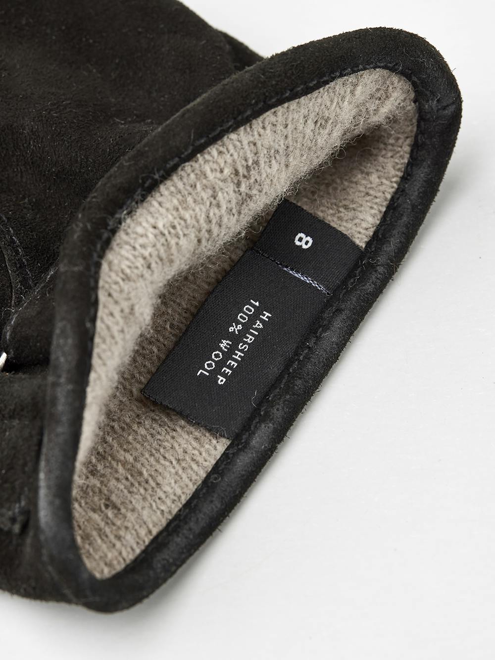 Black machine-sewn suede glove with leather strap and button
(3 of 4)