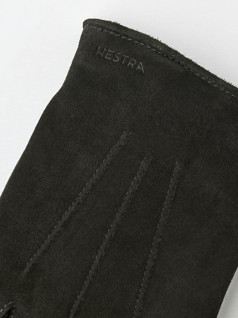 Black machine-sewn suede glove with leather strap and button
(2 of 4)