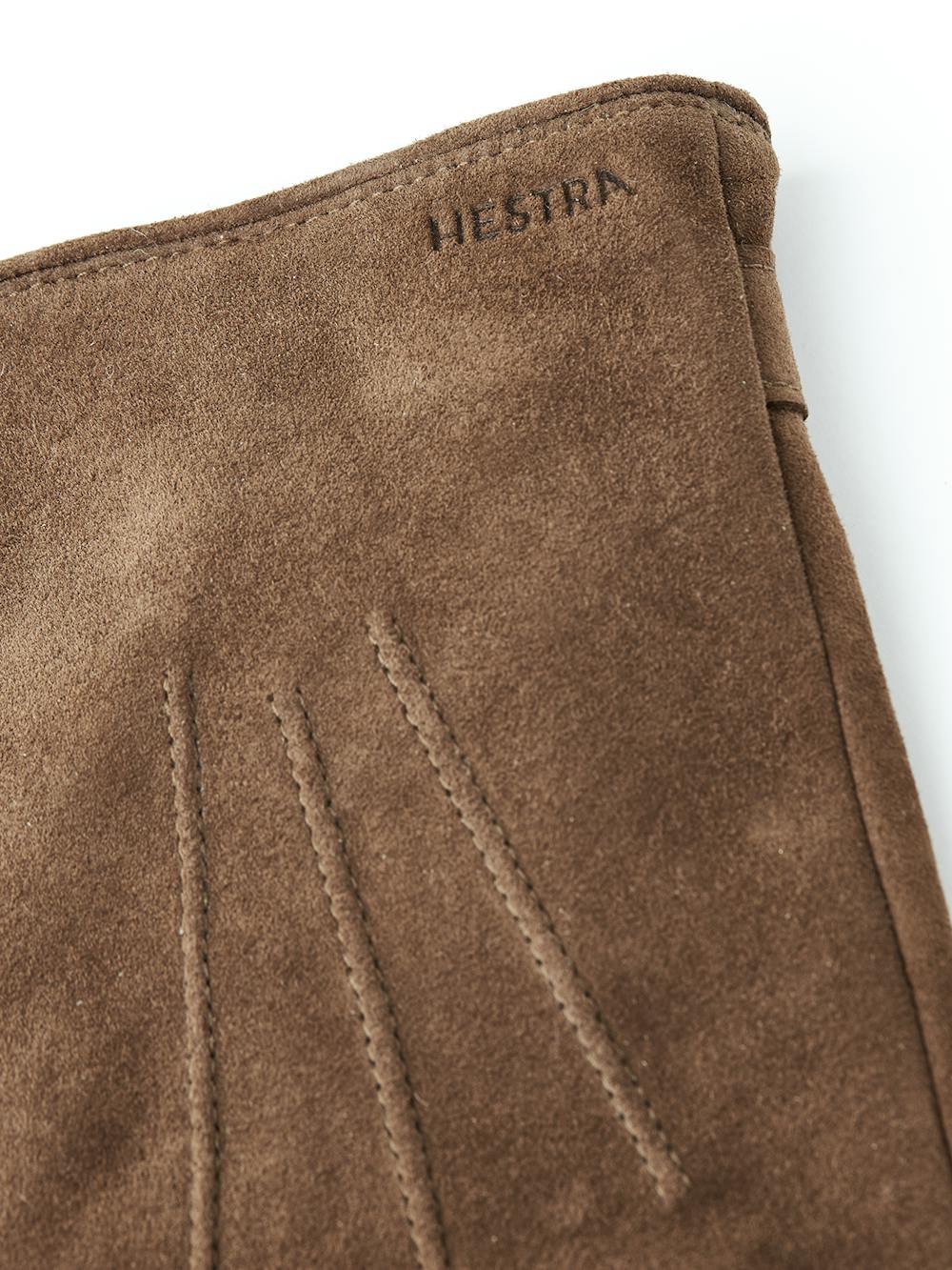 Light brown machine-sewn suede glove with leather strap and button
 (4 of 4)