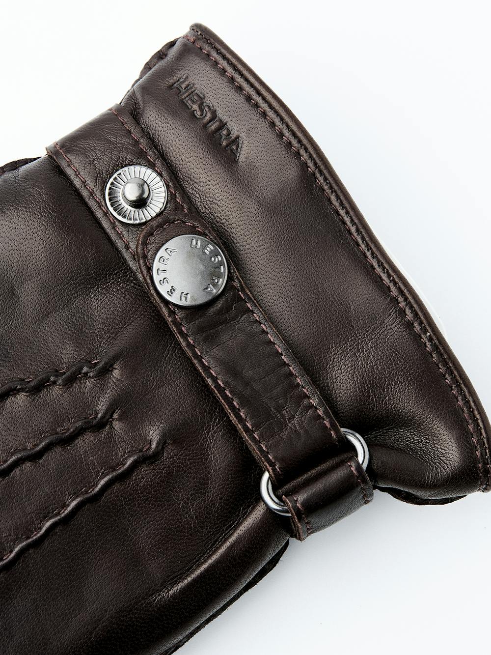 Dark brown hand-sewn hairsheep leather glove with leather strap and button
(3 of 4)