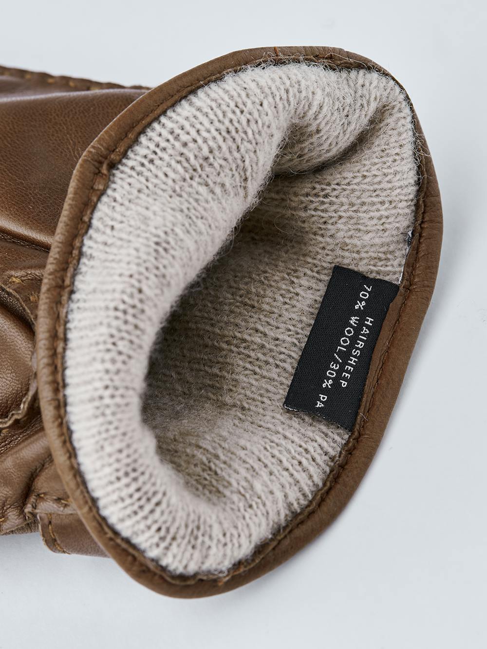 Light brown hand-sewn hairsheep leather glove with leather strap and button
(4 of 4)