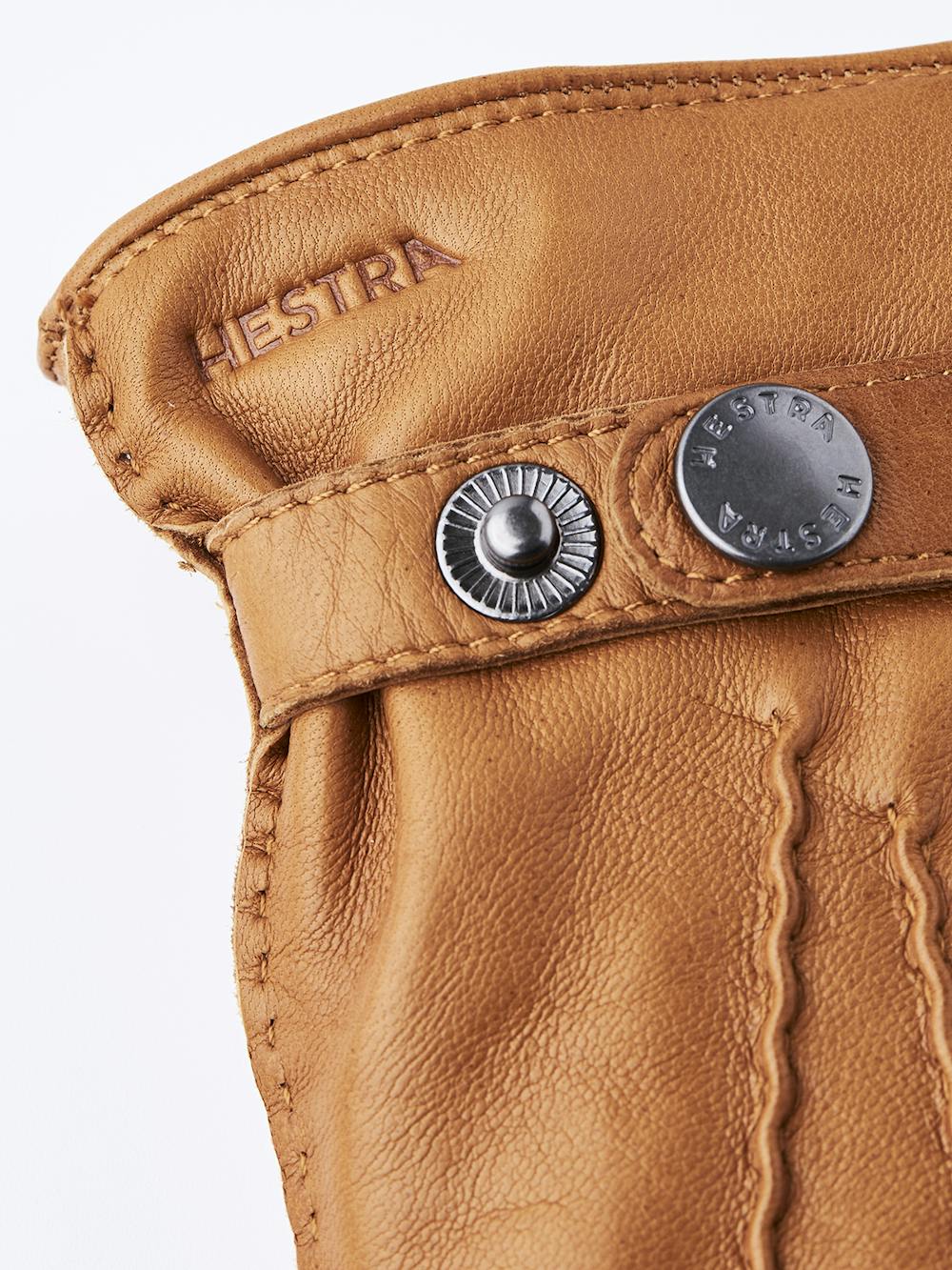 Light brownish-yellow hand-sewn hairsheep leather glove with leather strap and button
 (2 of 4)