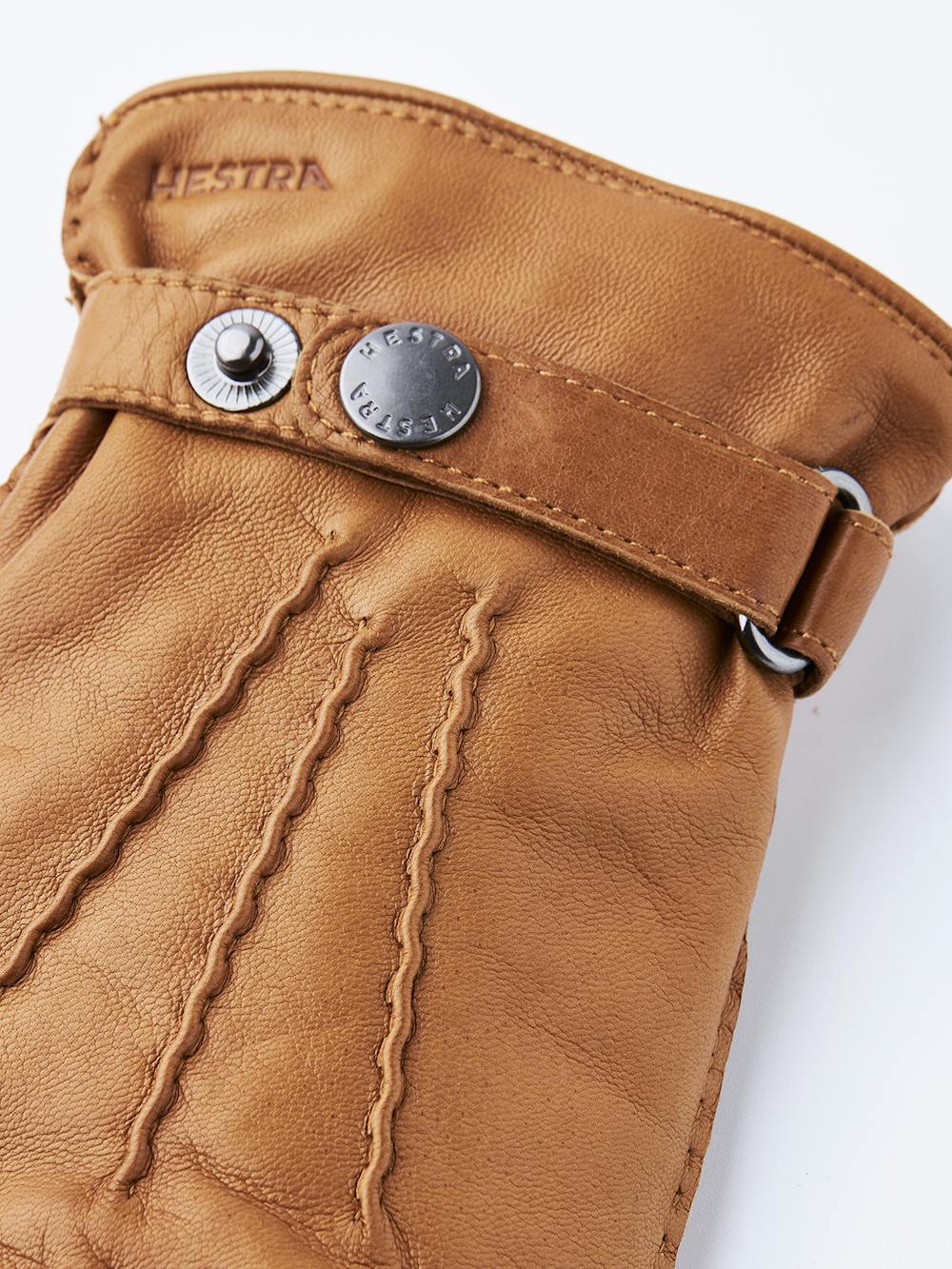 Light brownish-yellow hand-sewn hairsheep leather glove with leather strap and button
 (3 of 4)