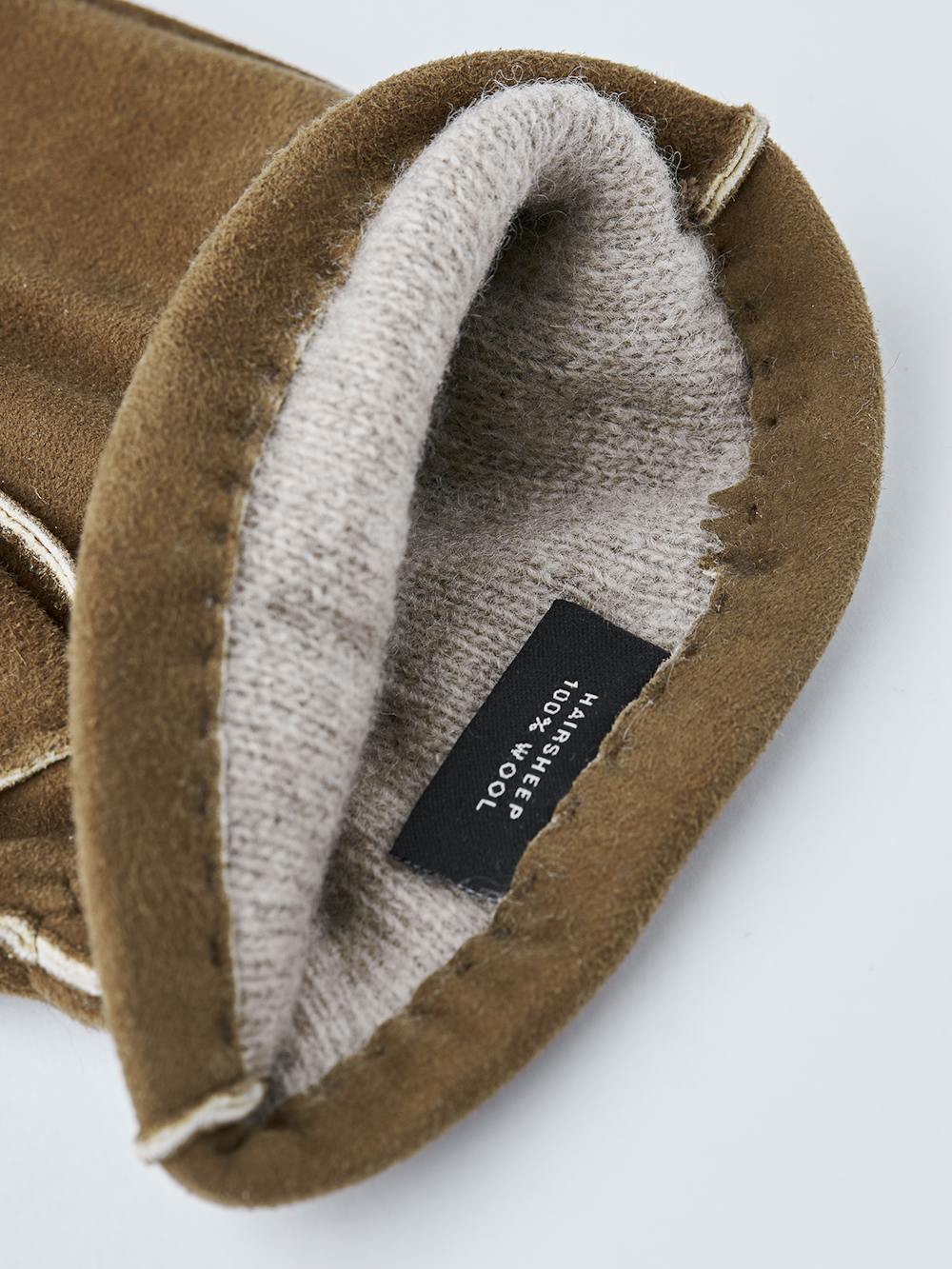 Brauner handgenähter Handschuh aus Wildleder mit Gummizug am Handgelenk
(4 oder 4)