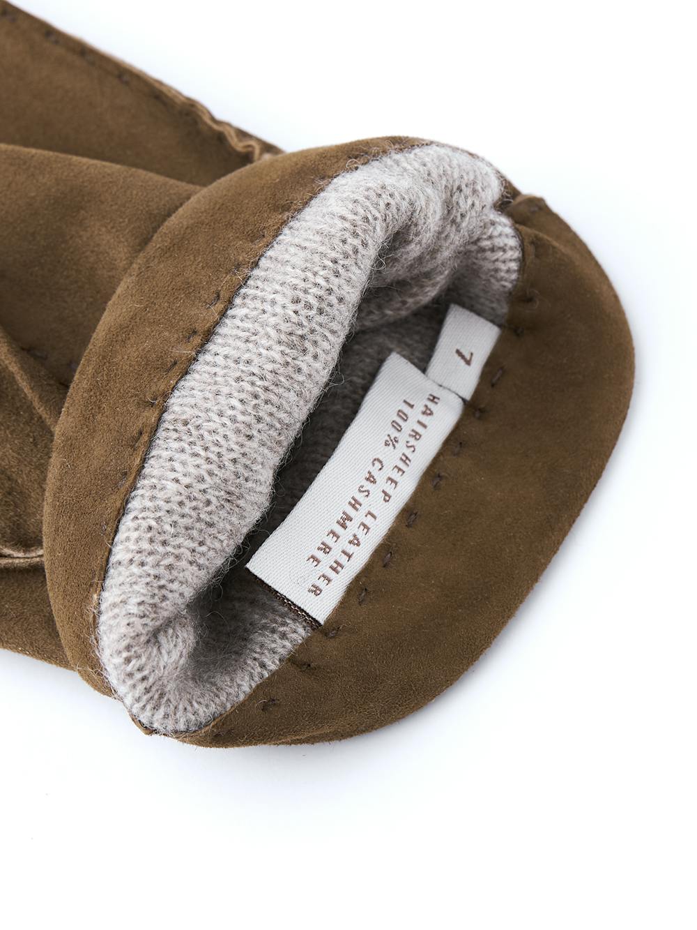 Ljusbrun handsydd handske i mocka
(4 av 4)